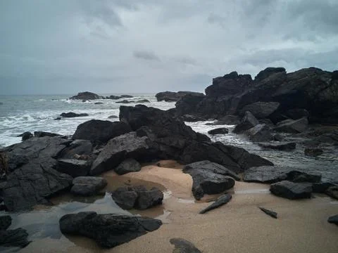 Rocks on the beach after the storm Stock Photos