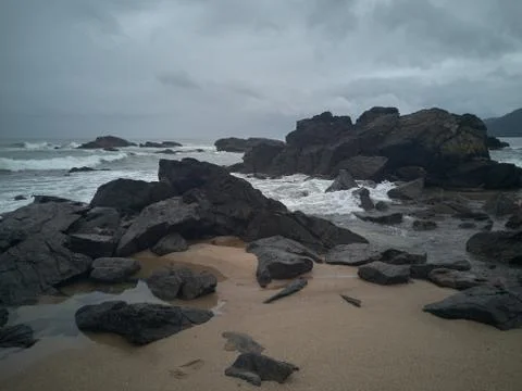 Rocks on the beach after the storm Stock Photos