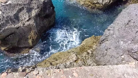 The rocks on the beach are hit by ocean waves Stock Footage 297136479