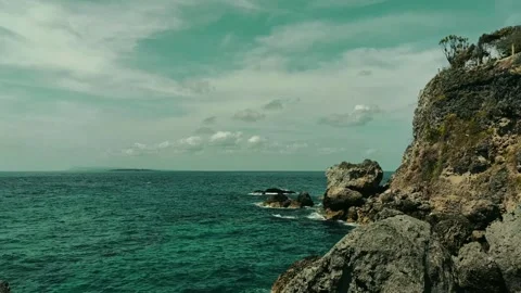 The rocks on the beach are hit by ocean waves Stock Footage 297137747