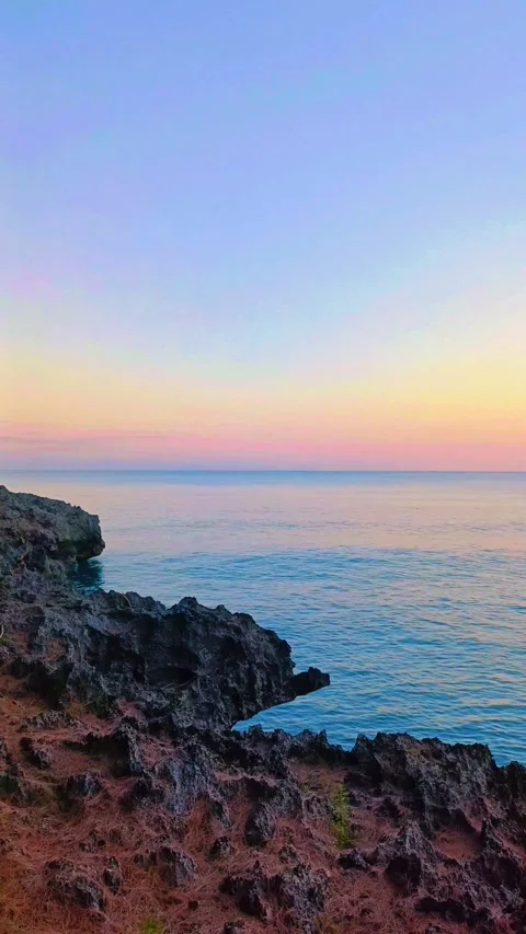 Rocks on the beach with calm waves Stock Footage 297035674