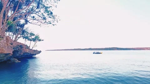 Rocks on the beach with calm waves Stock Footage 297134113