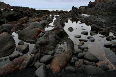 Rocks on the beach Stock Photos