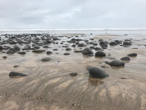 Rocks on a beach Stock Photos