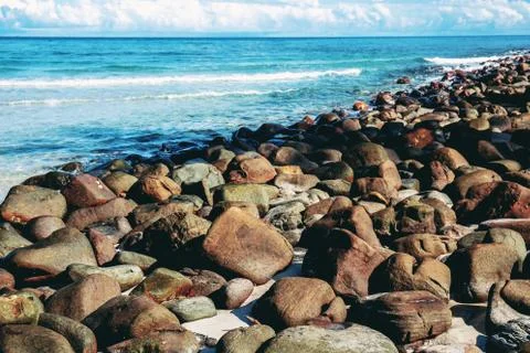 Rocks on beach with sunlight. Foto stock
