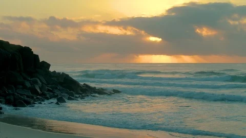 Rocks on beach sunrise Stock Footage 86462832