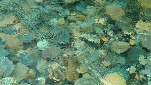 Rocks benith flowing water Stock Footage 260369640
