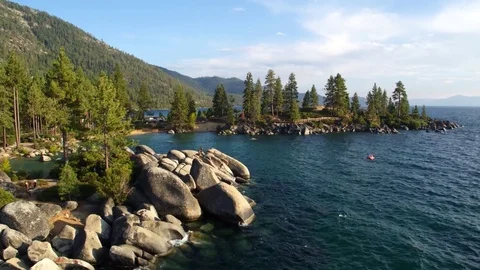 Rocks in the Blue Water of Lake Tahoe by Aerial Drone Stock Footage