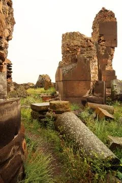 Rocks, bricks and pillars are lying around inside the ruins of King Gagik`s.. Stock Photos