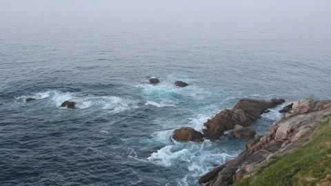 Rocks in the Cantabrian sea at sunset Stock Footage 273974941