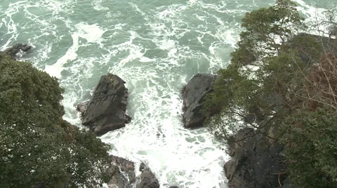 Rocks cliff surf snow Video stock 32137959