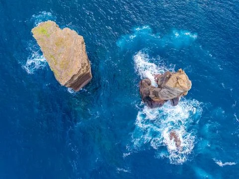 Rocks, cliffs, waves and turquoise water in Atlantic ocean. Aerial drone view 스톡 사진