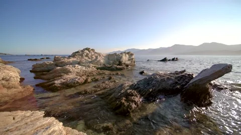 Rocks in the coast with sea moving Stock Footage 169688742