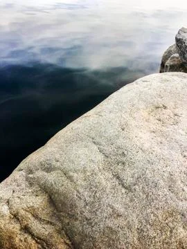Rocks at the edge of water Stock Photos