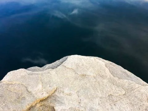 Rocks at the edge of water Stock Photos
