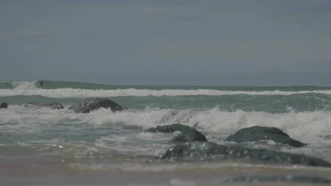 Rocks emerging from sea Stockbeeldmateriaal 342925595