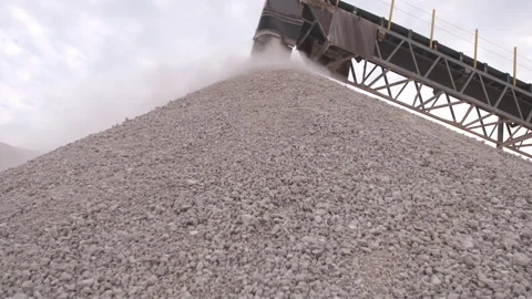 Rocks falling down pile from crusher wide shot Stock Footage 311089118