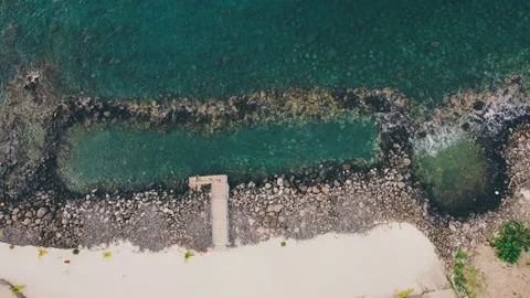 Rocks form  shape in ocean blue water Stock Footage 229187935