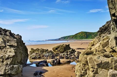 Rocks framing a view of Killantringan Bay Stock Photos