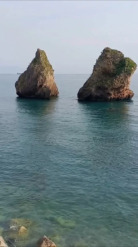 Rocks in front of the beach called 'the two Brothers' Stock Footage 289472910