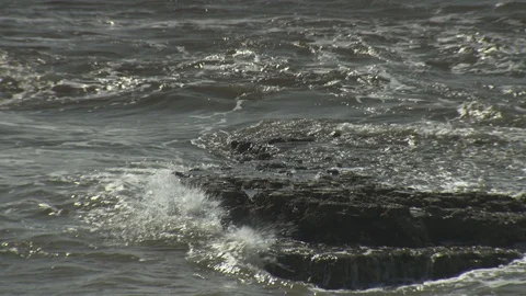 Rocks Glinting With The Fresh Wash Of The Lapping Waves. 스톡 동영상 107326393