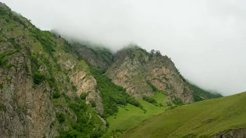Rocks, greenery and misty haze Stock Footage 342713809