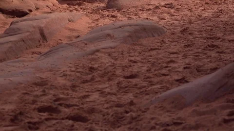 Rocks on hiking path through red dirt path tilt shot 4k Video stock 72793248