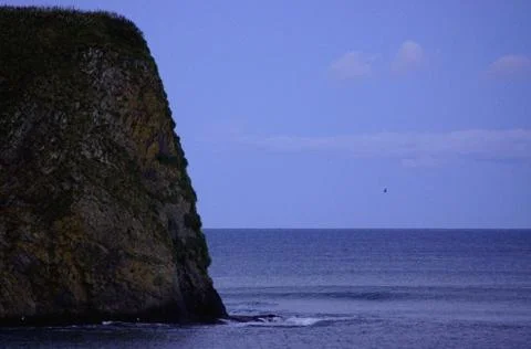 Rocks of the island of Kunashir. Stock Photos