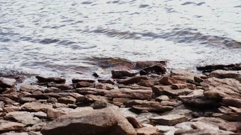 Rocks on lake shoreline Stock Footage 228655591