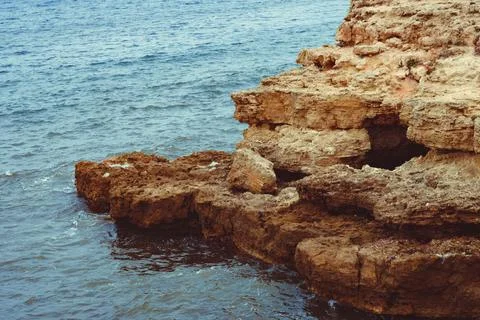 Rocks ledges by the sea Stock Photos