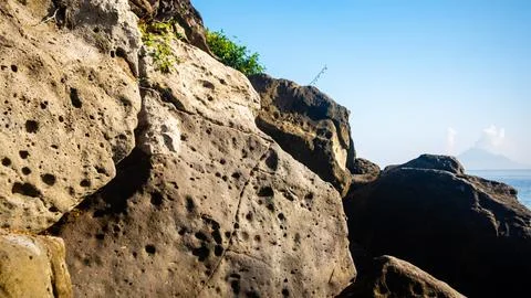 Rocks that line the beach Stock Photos