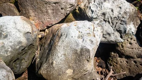 Rocks that line the beach Stock Photos