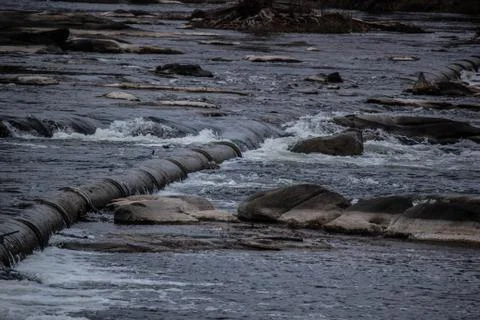 Rocks in middle of river Stock Photos