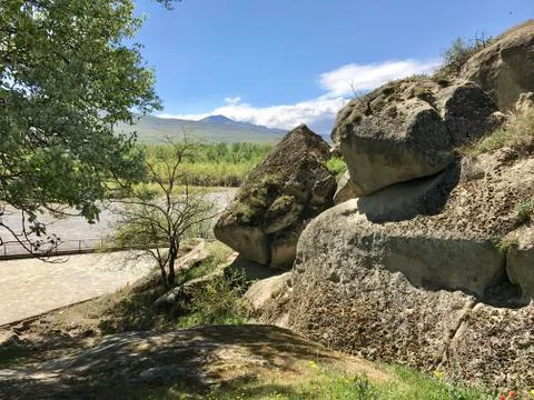 Rocks on mountain river Stock Photos