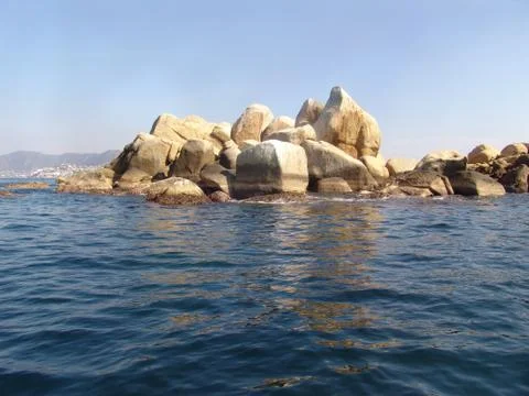 Rocks in ocean Stock Photos