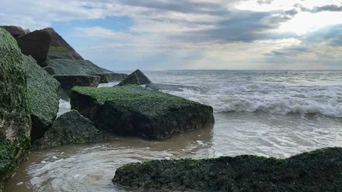 Rocks by the ocean slow motion Stock Footage 142357167