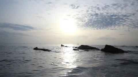 Rocks in ocean at sunrise Stock Footage 29906869