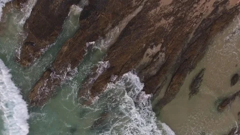 Rocks in ocean at sunset Stock Footage 76244610