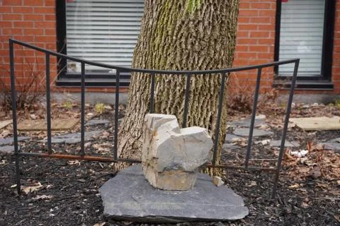 Rocks pattern with a decorative black fence Stock Photos