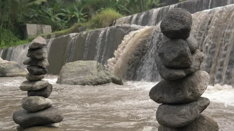 Rocks piled vertically around a shallow stream in a tropical forest Stock Footage 234947101
