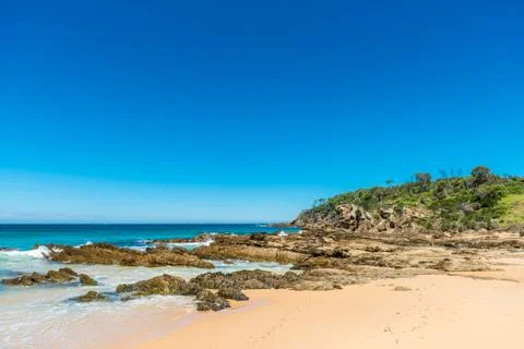 Rocks on sandy beach Foto stock