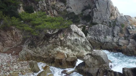Rocks on the sea, aerial view going out to sea Stock Footage 160551766