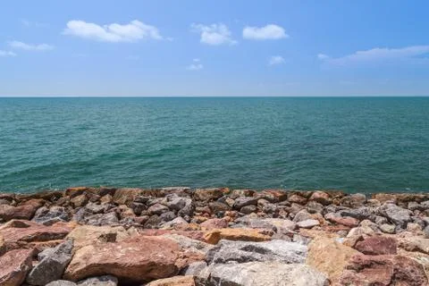 Rocks by the sea and blue sky. Stock Photos