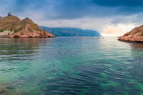 Rocks, sea and dramatic clouds, beautiful seascape Stock Photos