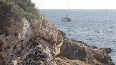 Rocks by the sea, boat Stock Footage 127870892