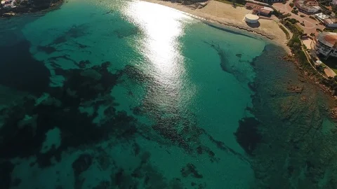 Rocks sea mediterranean view by drone aerial top water sun 4k Stock Footage 99340342