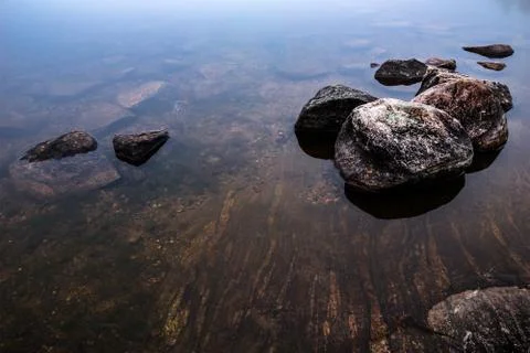 Rocks in sea Stock Photos