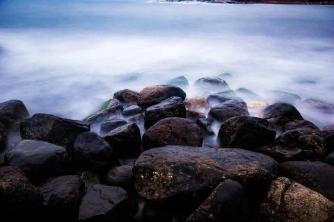 Rocks in sea Stock Photos