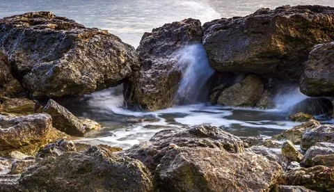 Rocks in sea Stock Photos