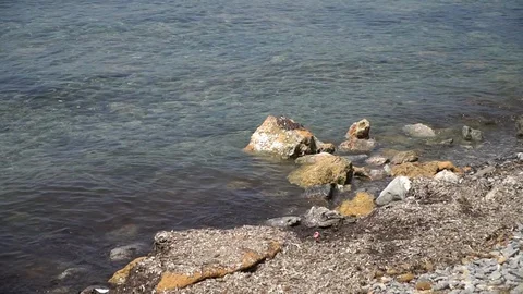 Rocks sea shore Stock Footage 128347307